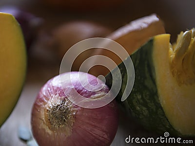 Close up of red onion and pumpkin food photography recipe idea Stock Photo