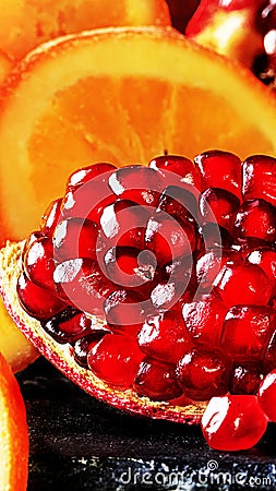 Red Pomegranate and Dried Orange Slice Stock Photo
