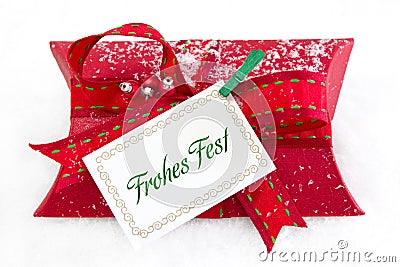 Close up of red present box with German text for christmas - coupon for a gift Stock Photo