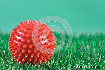 close up red therapy ball for massage on grass background Stock Photo