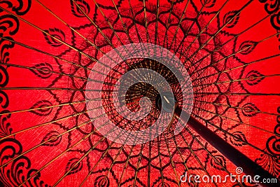 Close up of a red traditional burmese umbrella view from inside, asian background Stock Photo