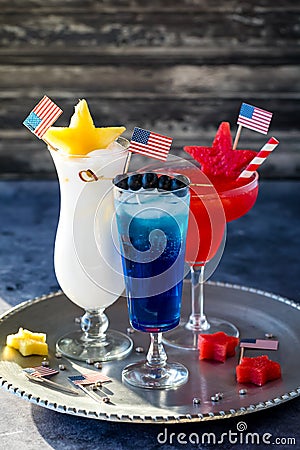 Close up of red, white and blue cocktails on a tray to celebrate 4th of July. Stock Photo