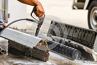 Close up of Repairman washing dirty inside compartments air conditioner, Technical team clean mold in system air conditioning Stock Photo