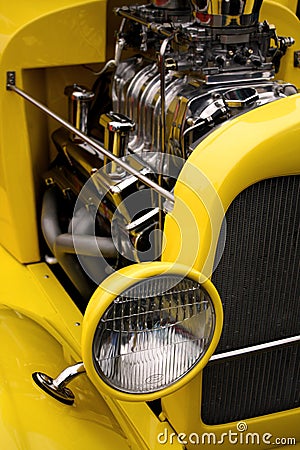 Retro Headlight and Engine on a Yellow Vintage Car Stock Photo