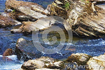 Close up of Rocks in a flowing River Stock Photo