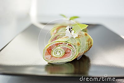 Close up of rolls with spinach pancake, salmon and cream cheese. Food delivery and catering concept Stock Photo