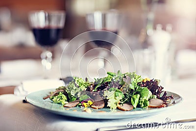 Couple eating romantic Dinner in a gourmet restaurant drinking wine and eating Stock Photo