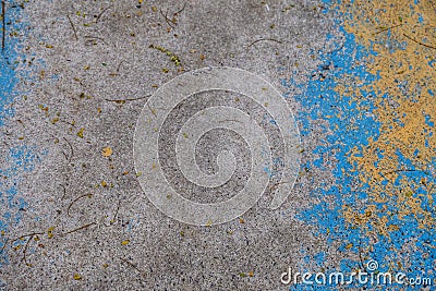 Dirty cement ground floor with blue yellow colors painted on skin surface for background texture Stock Photo