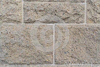 Close up on rough rectangular stone bricks in wall Stock Photo