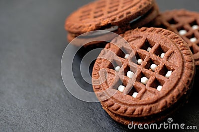 Close-up round chocolate chip cookies with white filling. Stock Photo