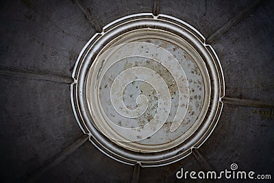 Close up of round gray, old symmetric ceiling with pealing paint Stock Photo