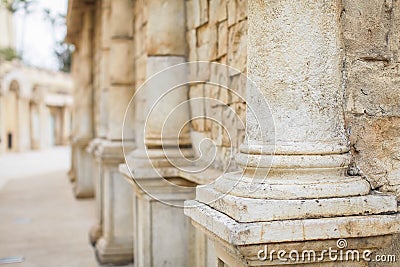 Close up row of columns receding into the distance. Pillars in Old Retro Style Stock Photo