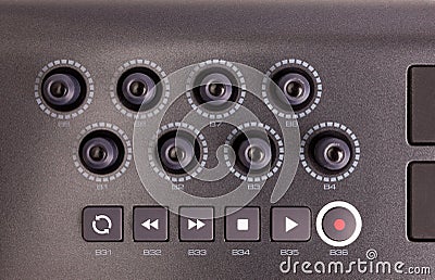 Close-up of a row of knobs on a MIDI controller Keyboard Stock Photo