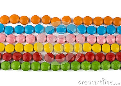 Close-up of rows of colorful chocolates on a white background Stock Photo