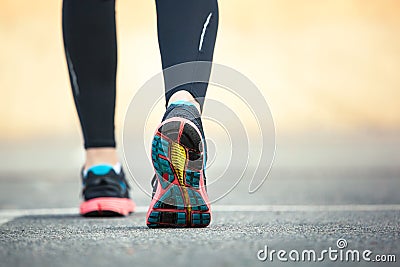 Close up of running shoes on road. Stock Photo