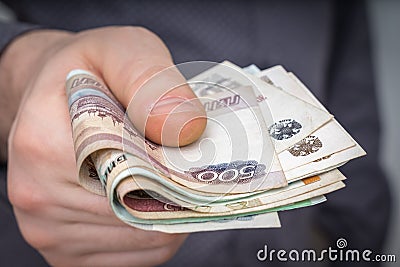 Close-up of russian banknotes in hand of man Stock Photo