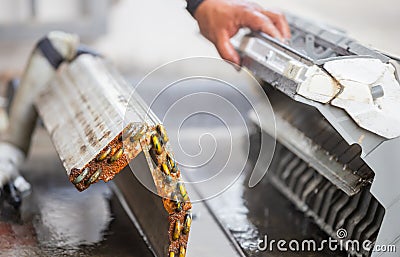 Close up of Rust and dirty inside compartments air conditioner, repairman clean mold in system air conditioning system, Repair and Stock Photo