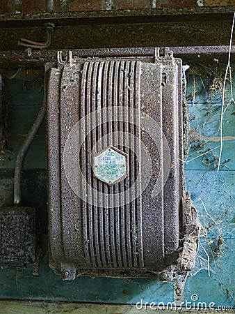 Close up of a rusted Brown Electrical Switch cover within a Technical Building at Stracathro Airfield Editorial Stock Photo