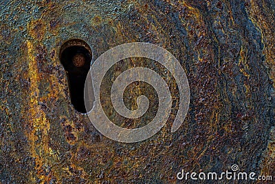 Close up of rusted corroded metal door with a keyhole Stock Photo