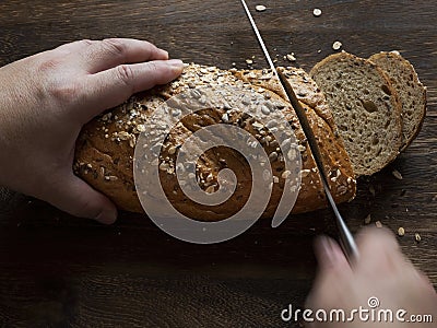 Rustic bread slicing action motion blur Stock Photo