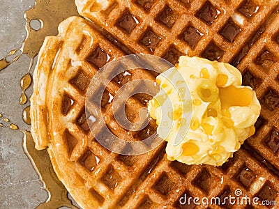 Rustic traditional waffle with butter and maple syrup Stock Photo