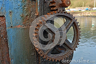 Close up of rusty wheel and cog of manual boat lifting mechanism Stock Photo