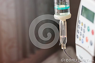 Close up saline solution drip and infusion pump Stock Photo