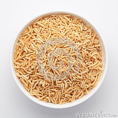 Close-Up of Salty plane Bhujia in a white ceramic bowl, made with Chickpeas or gram flour Besan. Indian salty snacks Namkeen Stock Photo