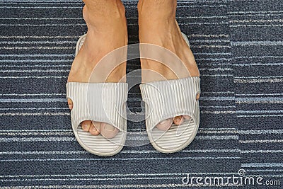 Sandal is too tight for men`s feet to get into Stock Photo