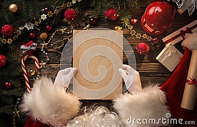 Santa Claus hands holding blank letter Stock Photo