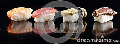 Close up of sashimi sushi set with chopsticks and soy - sushi roll with salmon and sushi roll with smoked eel, selective focus. Stock Photo