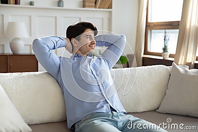 Close up satisfied dreamy young man looking to aside, relaxing Stock Photo