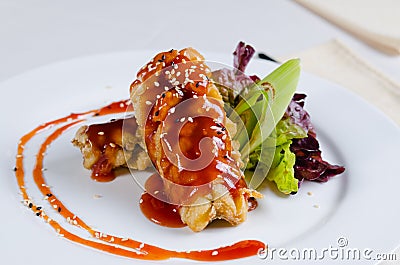 Close up Saucy Crispy Chicken with Sesame Seeds Stock Photo