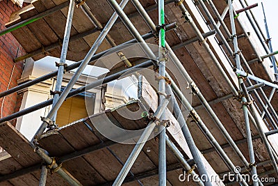 a close up of scaffolding poles on a building site using selective focus Stock Photo