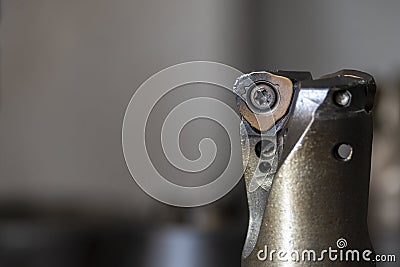 Close-up scene of chip of indexable tool wear cause from bad cutting condition. Stock Photo