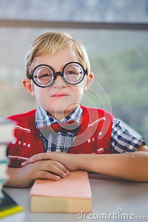 Close-up of schoolkid pretending to be a teacher in classroom Stock Photo