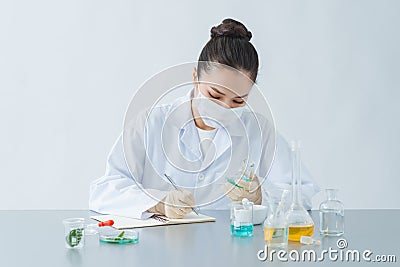 Close Up Of Scientist Checking Test Tube In Laboratory Stock Photo