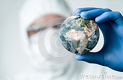 Close up of scientist holdnig and analyzing planet earth Stock Photo