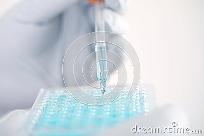 Close up a scientist working in laboratory to analyze blue extra Stock Photo