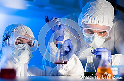 Close up of scientists making test in lab Stock Photo