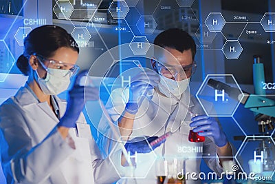 Close up of scientists making test in lab Stock Photo