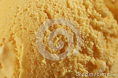 Close up of Scoop of delicious real fresh ice cream in Mango flavour. Stock Photo