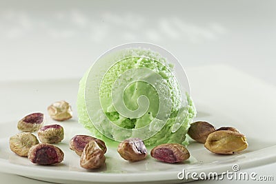 Close up of Scoop of delicious real fresh ice cream in Pistachio flavour. Stock Photo