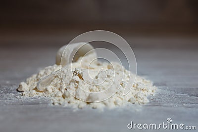 Close-up scoop in protein powder slides Stock Photo