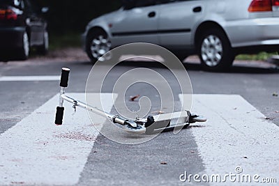 Scooter on pedestrian crossing Stock Photo