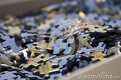 Close-up of a sea of jigsaw puzzles inside a box Stock Photo