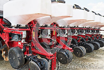 Close up of seeder attached to tractor in field. Agricultural machinery for spring works sowing Stock Photo