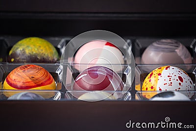 Close up of selection of colorful sweet delicious round shape chocolates in a box Stock Photo