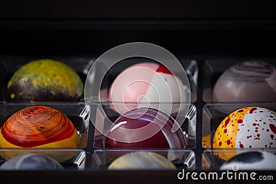Close up of selection of colorful sweet delicious round shape chocolates in a box Stock Photo