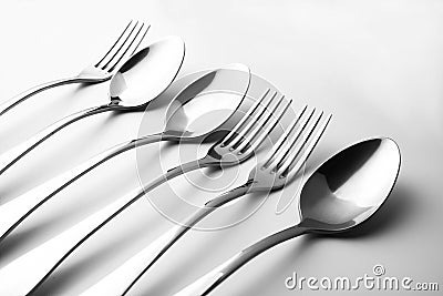 Close-up and selective focus of a set of cutlery on a white background. Flat spoon and top view of spoon, fork and knife with copy Stock Photo